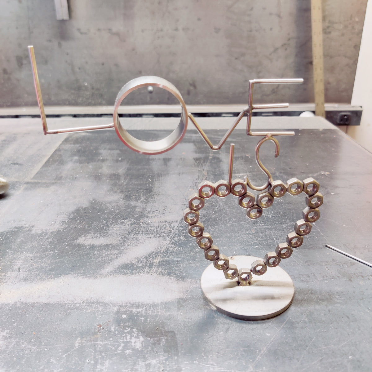 "LOVE IS NUTS" Stainless Steel Heart Sculpture | Handcrafted Industrial TIG Welded Art